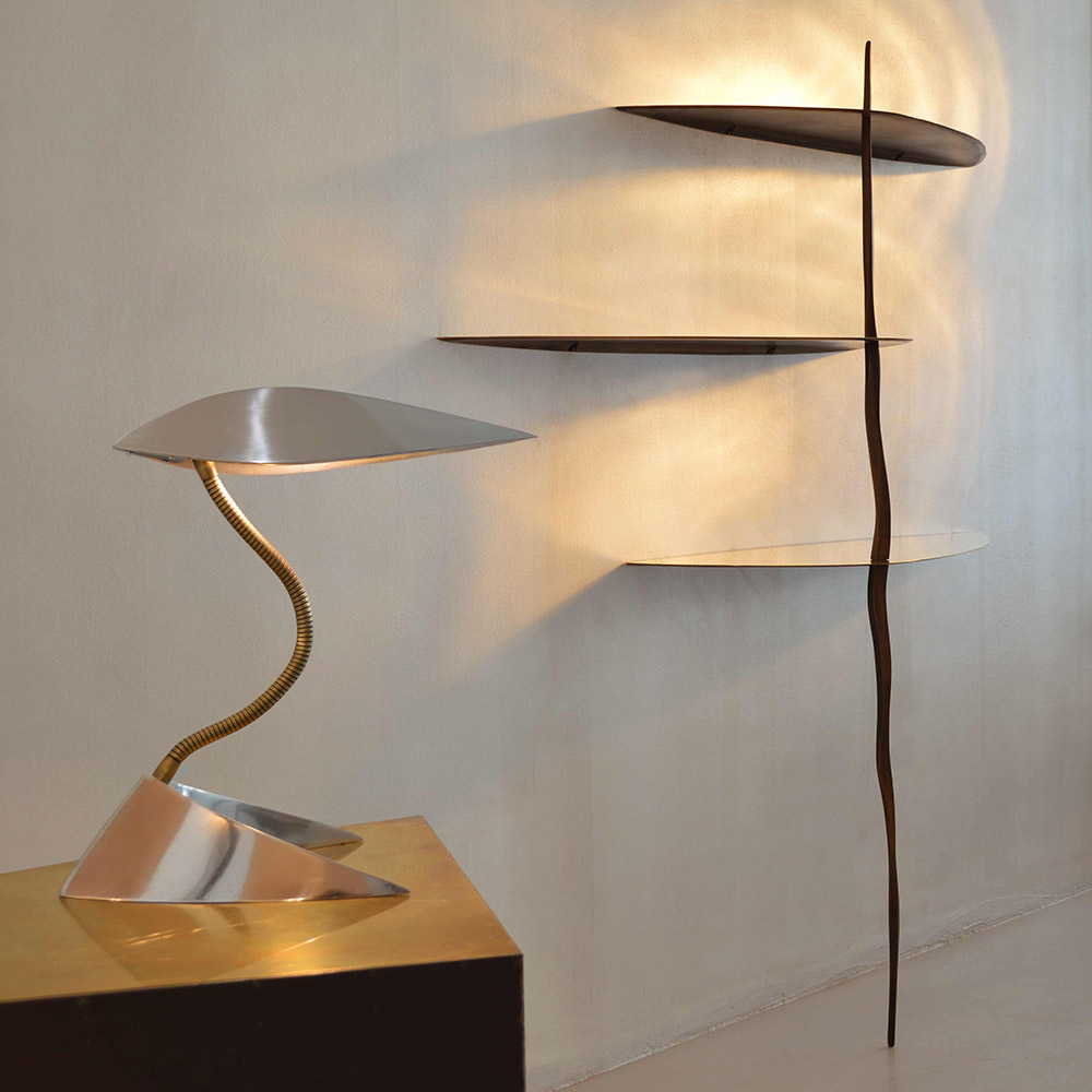 Kalimero is a table lamp made in polished aluminium and brass flexible neck