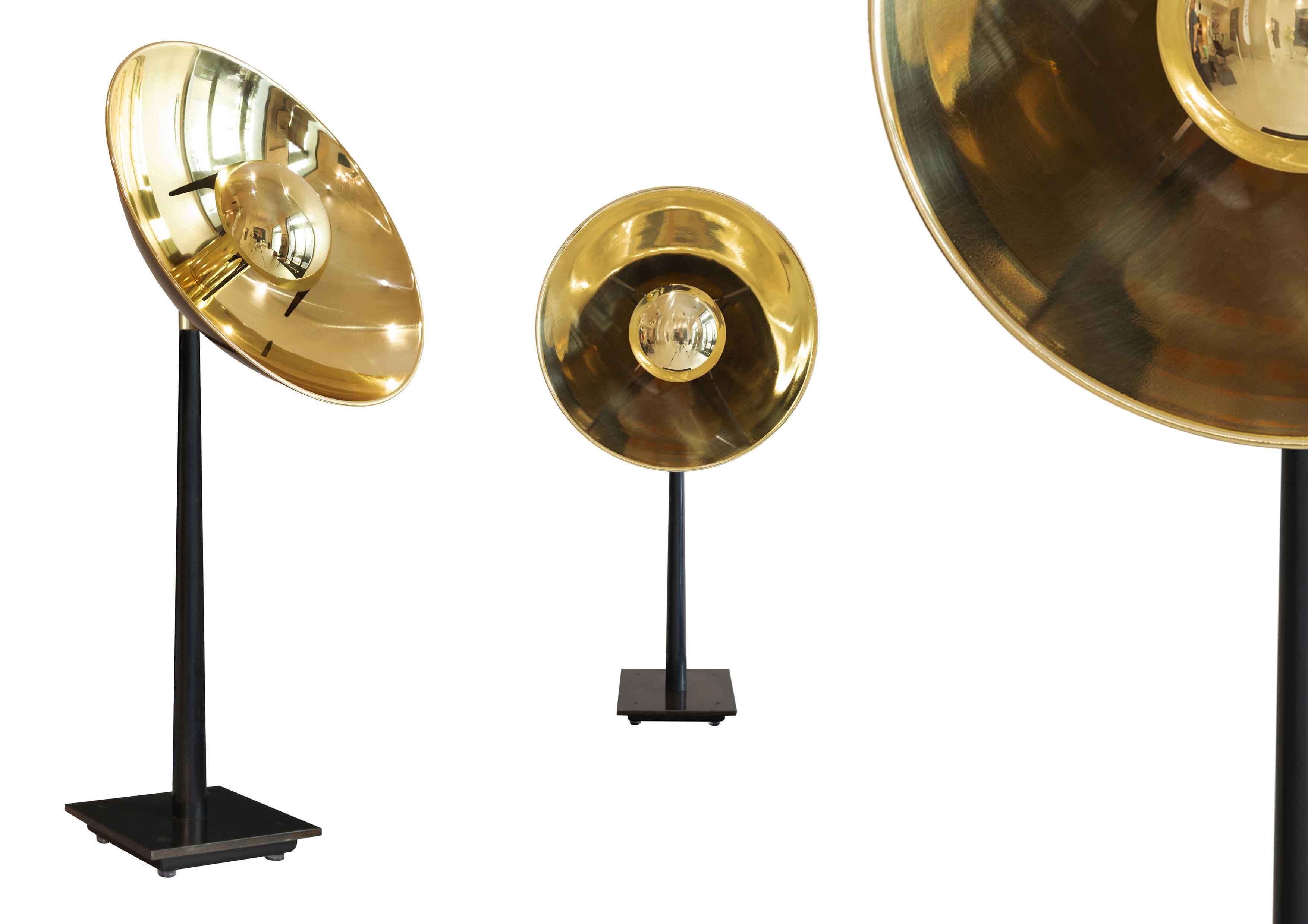 Orus Table lamp, is a modern light made in Italy with brass adjustable reflector